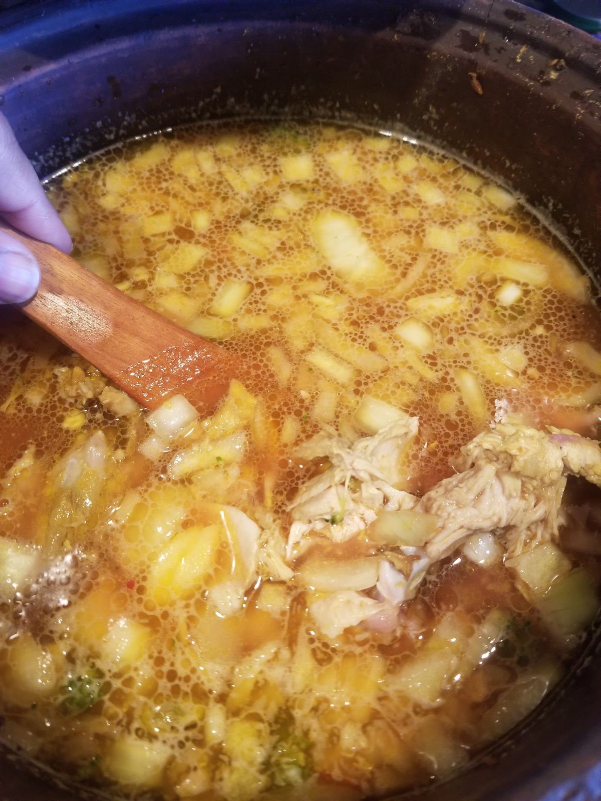 Big pot of healthy soup with holiday leftovers cooked in Miriam's Earthen Cookware clay pot